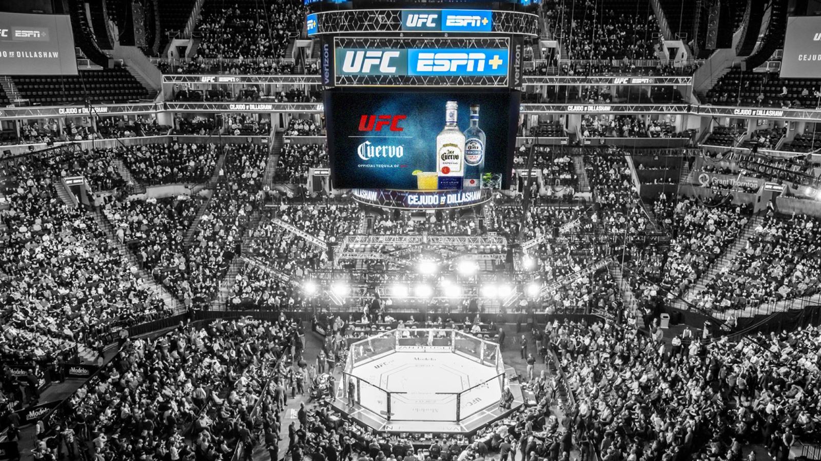 Arena center-hung screen showing the UFC and Cuervo lockup above the octagon